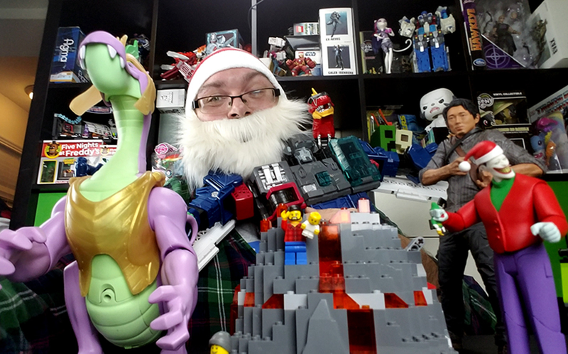 Hugging Fortress Maximus while holding a cell phone in my other hand. That’s how art is made. Damn it, Canon.